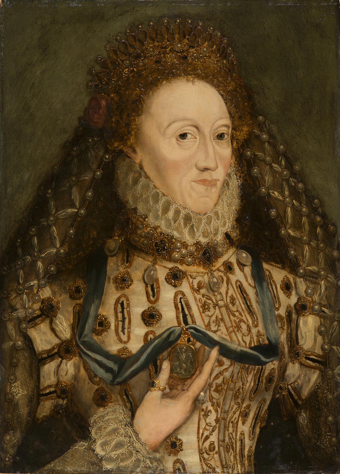 Elizabeth I (1533-1603) c. 1580-1603. Attributed to the British School. This is a contemporary portrait of Queen Elizabeth I near the end of her life, and is possibly based off of another portrait. In her hand, she holds the badge of the Order of the Garter, meant to establish her high prioritization and use of chivalry.